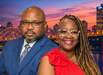 Anthony and Kena Perry in front of a city skyline